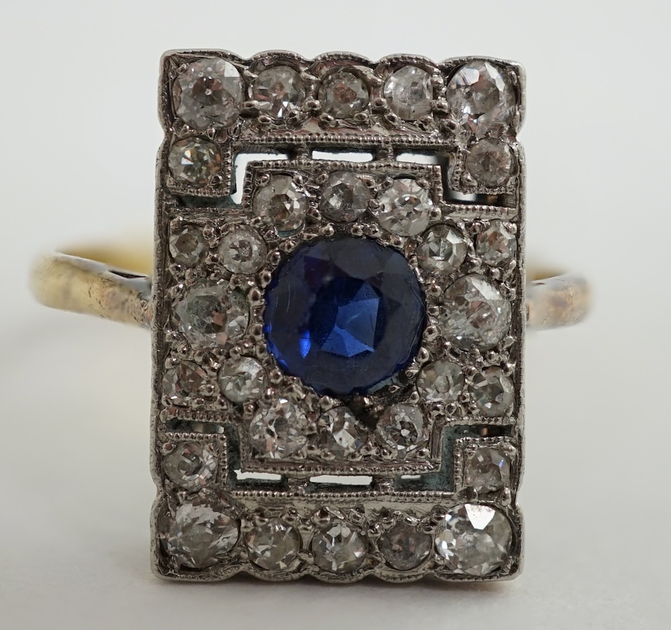 An early 20th century 18ct and platinum, millegrain set sapphire and diamond cluster tablet ring